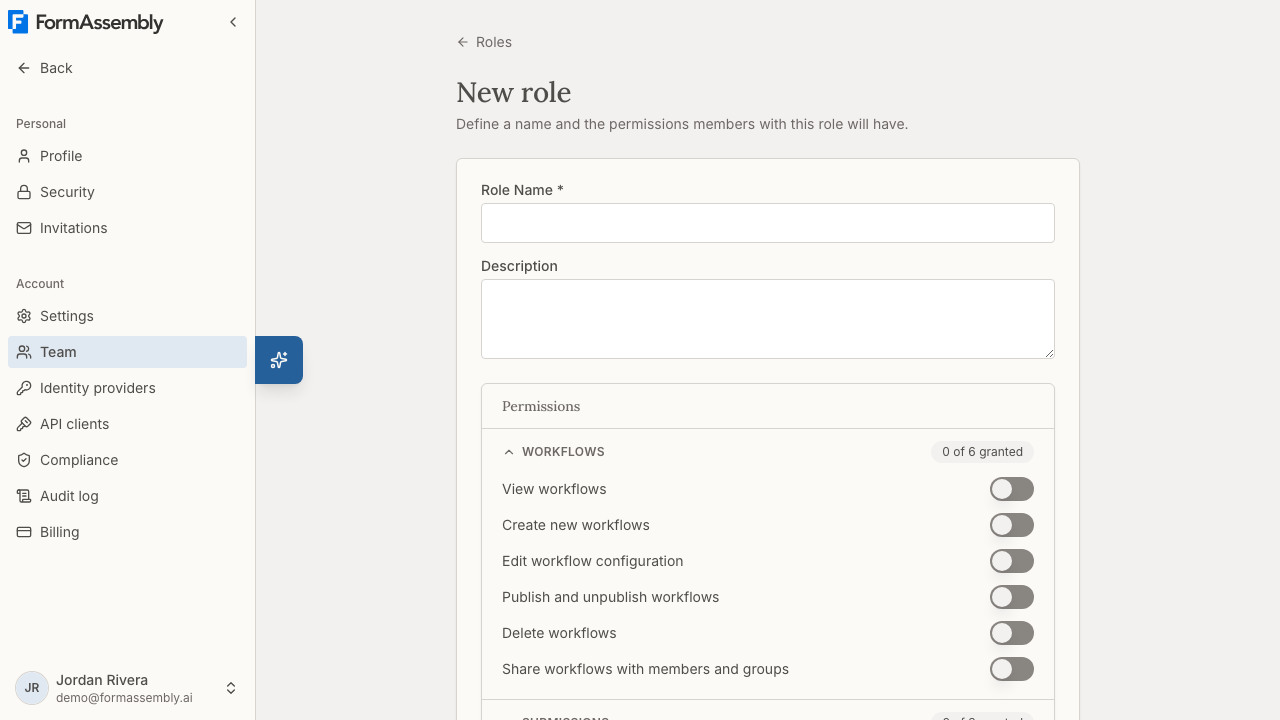 The Admin role detail page, showing granted permissions grouped by category and the members holding the role